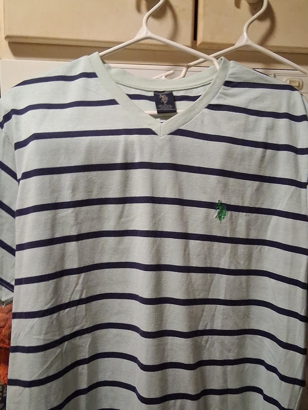 US POLO ASSN. By Ralph Lauren: Light Blue V-Neck Tee with Navy Stripes- Size Lg.